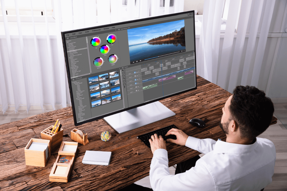 A young video animator doing video animations and editing a video