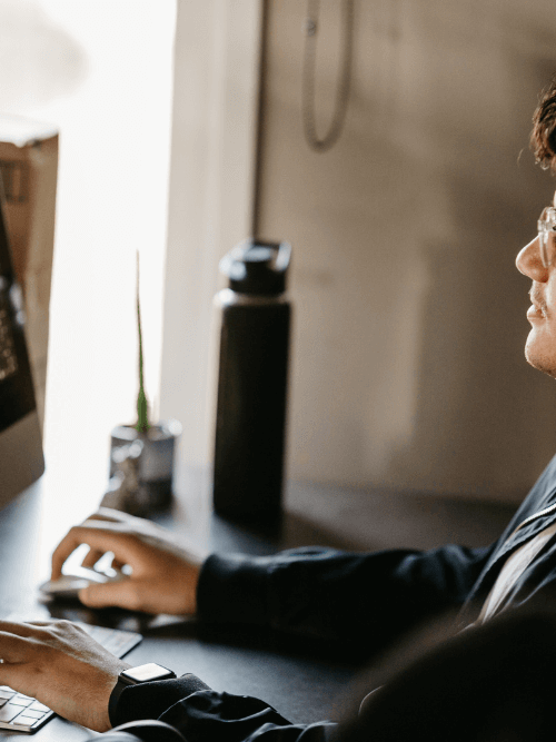 Young boy working on PC and doing graphic designing