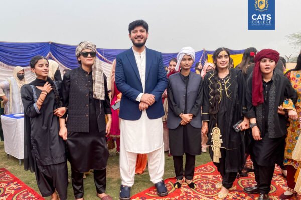 Vibrant student activities at an intermediate college in Lahore featuring traditional dance performances in a decorated campus hall.