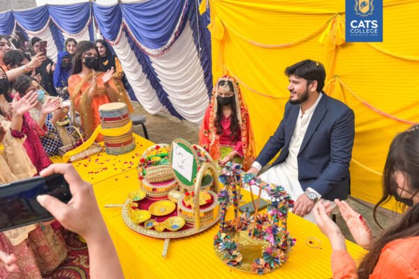 A cultural gathering at a premier private college in Lahore featuring students in regional dress, highlighting diverse degree programs in Lahore.
