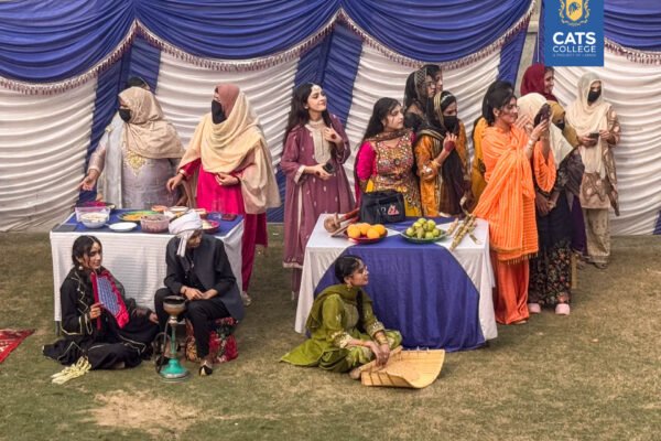 Faculty and students at one of the best colleges in Lahore posing in regional dress, with admissions open in Lahore colleges for new sessions.