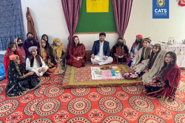 Faculty and students at one of the best colleges in Lahore posing in regional dress, with admissions open in Lahore colleges for the new academic session.