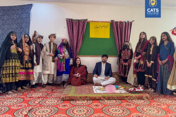 Cultural day celebration at an intermediate college in Lahore featuring students in traditional attire.