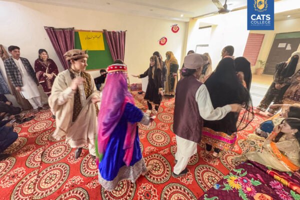 Students at a top private college in Lahore walking on campus during the admissions open season for various degree programs.
