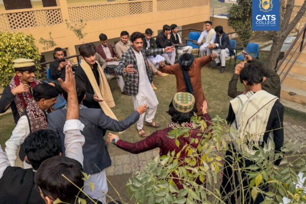 CATS College students performing a traditional Attan dance at a cultural day event, celebrating the vibrant campus community for those seeking admission open in cats college 2026.