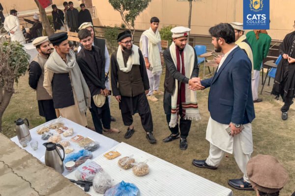 CATS College students in traditional attire networking at a campus event to discuss jobs after inter-tech in pakistan and diverse career options after FA/FSc.