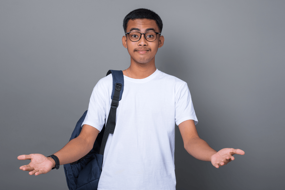 CATS student shrugging with a backpack, looking unsure about education or career choice